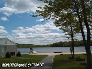 a view of a lake with table and chair