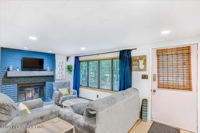 a spacious bedroom with a bed and a fireplace