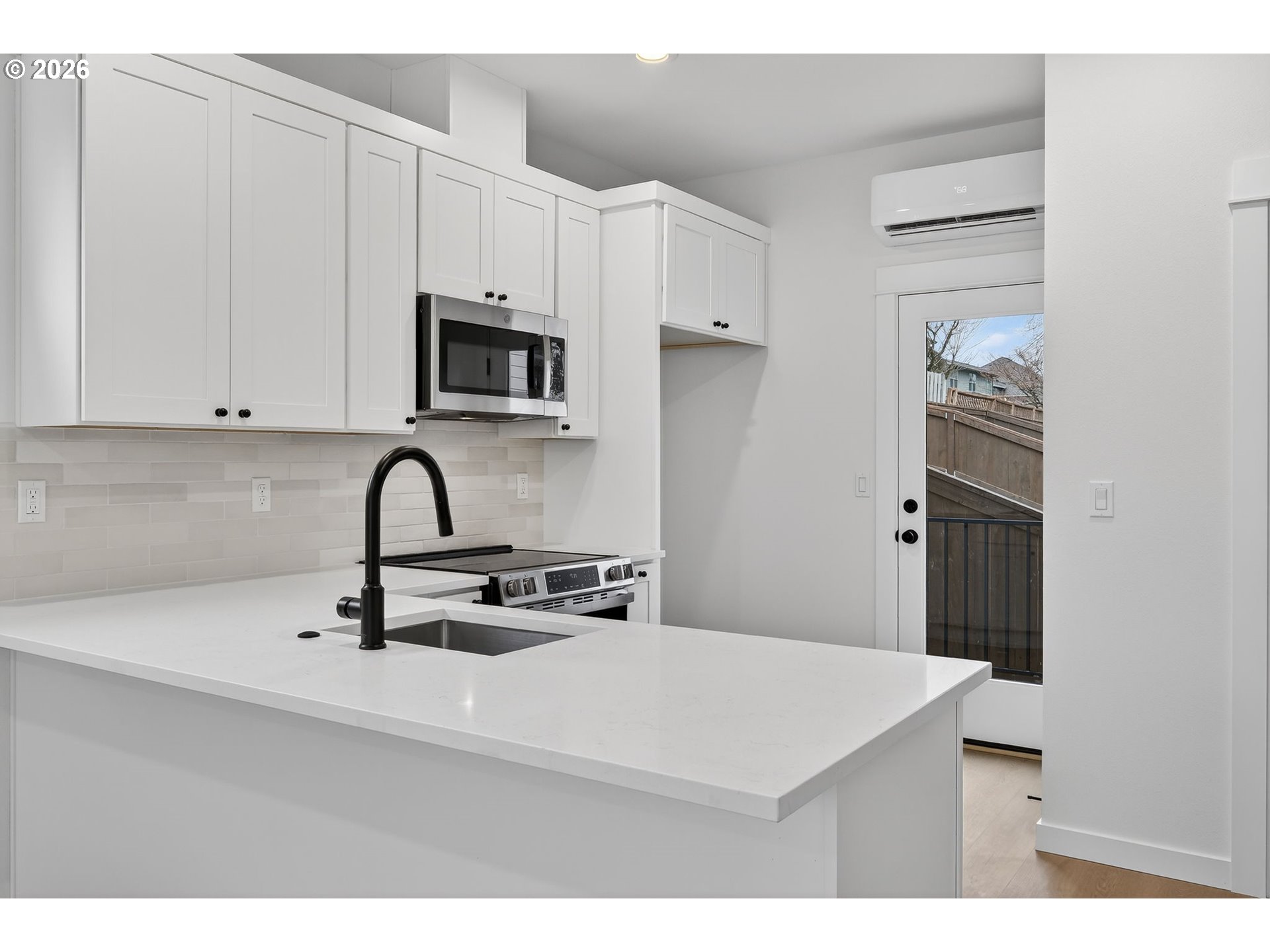 4059 Southwest McKinley Street, Unit 40 Gresham, OR 97080 - Photo 15 of 39 a kitchen with stainless steel appliances a sink a stove and refrigerator