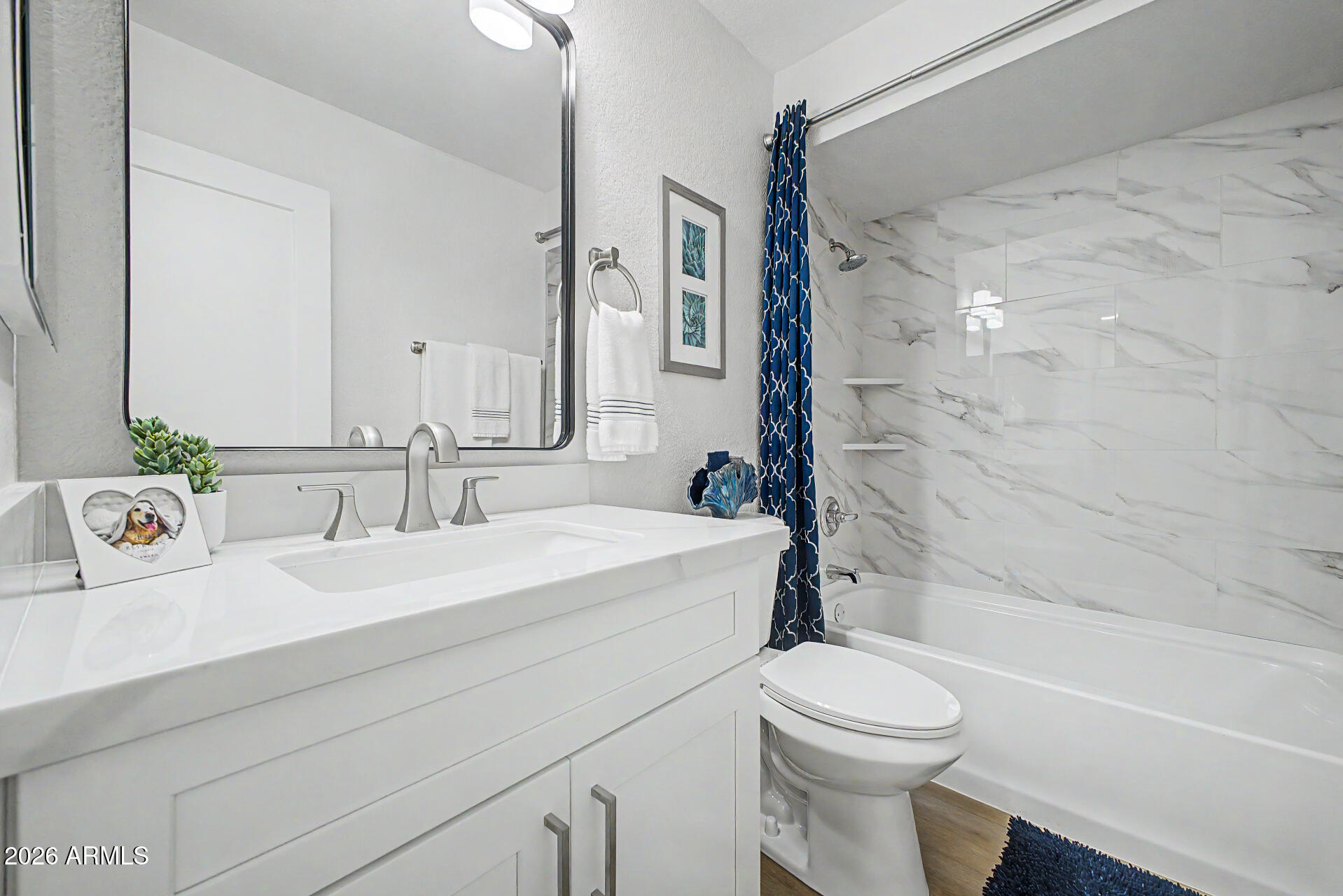 1009 West Pampa Avenue Mesa, AZ 85210 - Photo 22 of 31 a bathroom with a sink a toilet and a bathtub