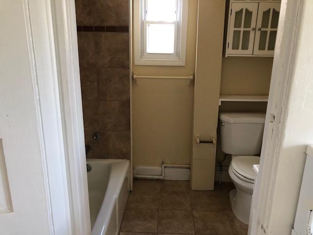 744 Wall Road Spring Lake Heights, NJ 07762 - Photo 8 of 15 a bathroom with a granite countertop toilet a sink and a bathtub