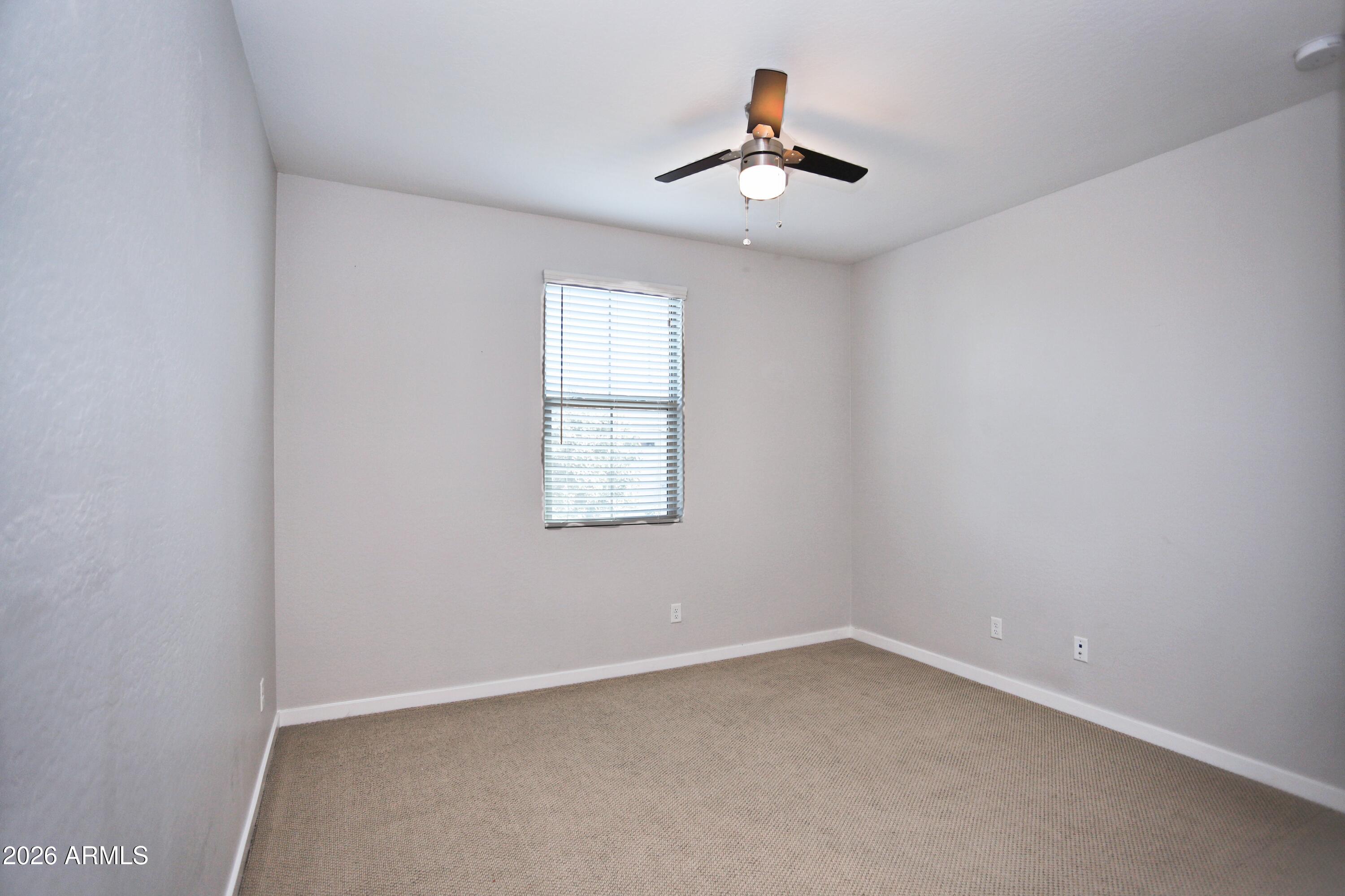 3855 South McQueen Road, Unit 110 Chandler, AZ 85286 - Photo 23 of 37 an empty room with a window