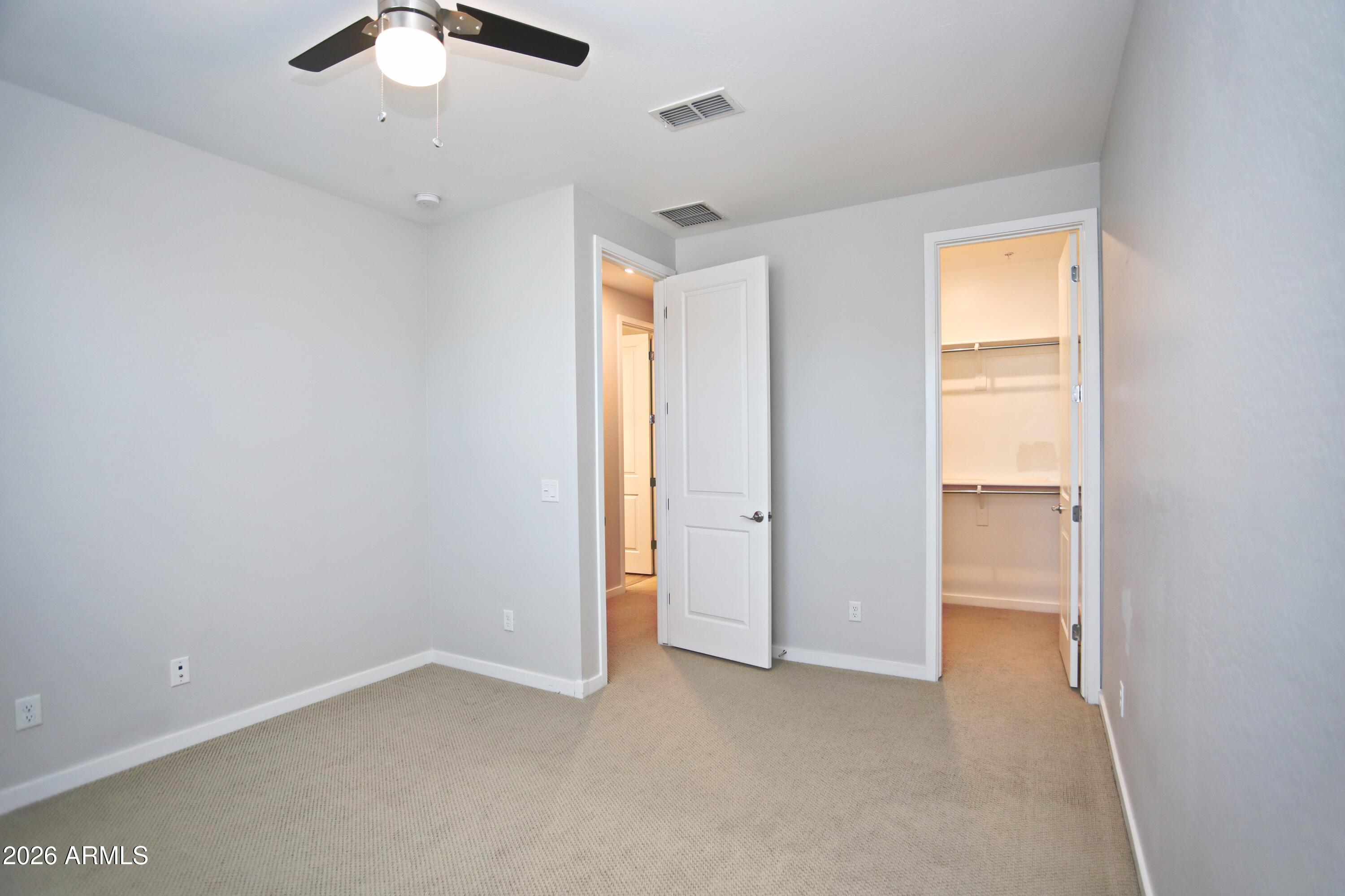 3855 South McQueen Road, Unit 110 Chandler, AZ 85286 - Photo 24 of 37 a view of an empty room with a window