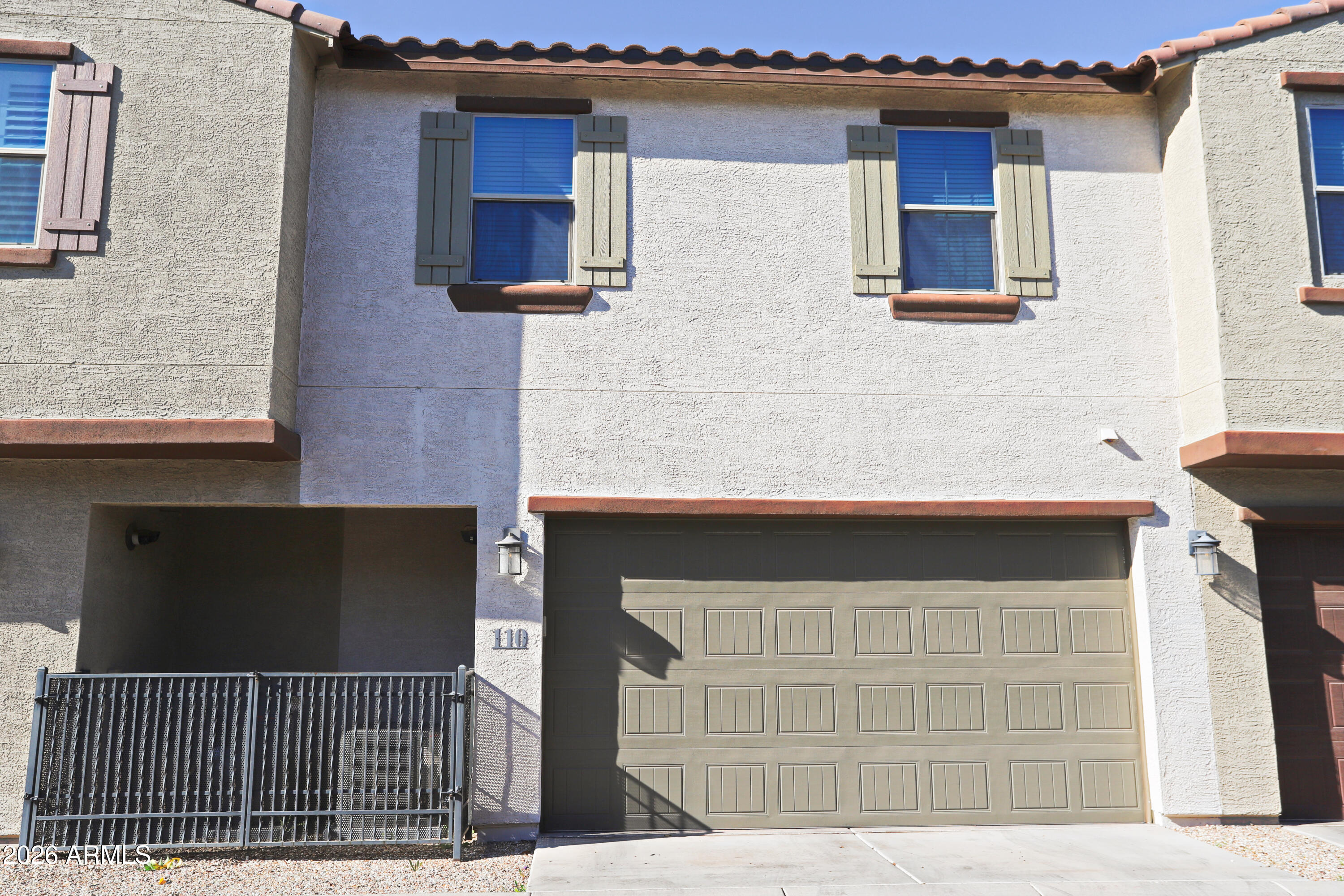 3855 South McQueen Road, Unit 110 Chandler, AZ 85286 - Photo 30 of 37 a front view of a house with garage