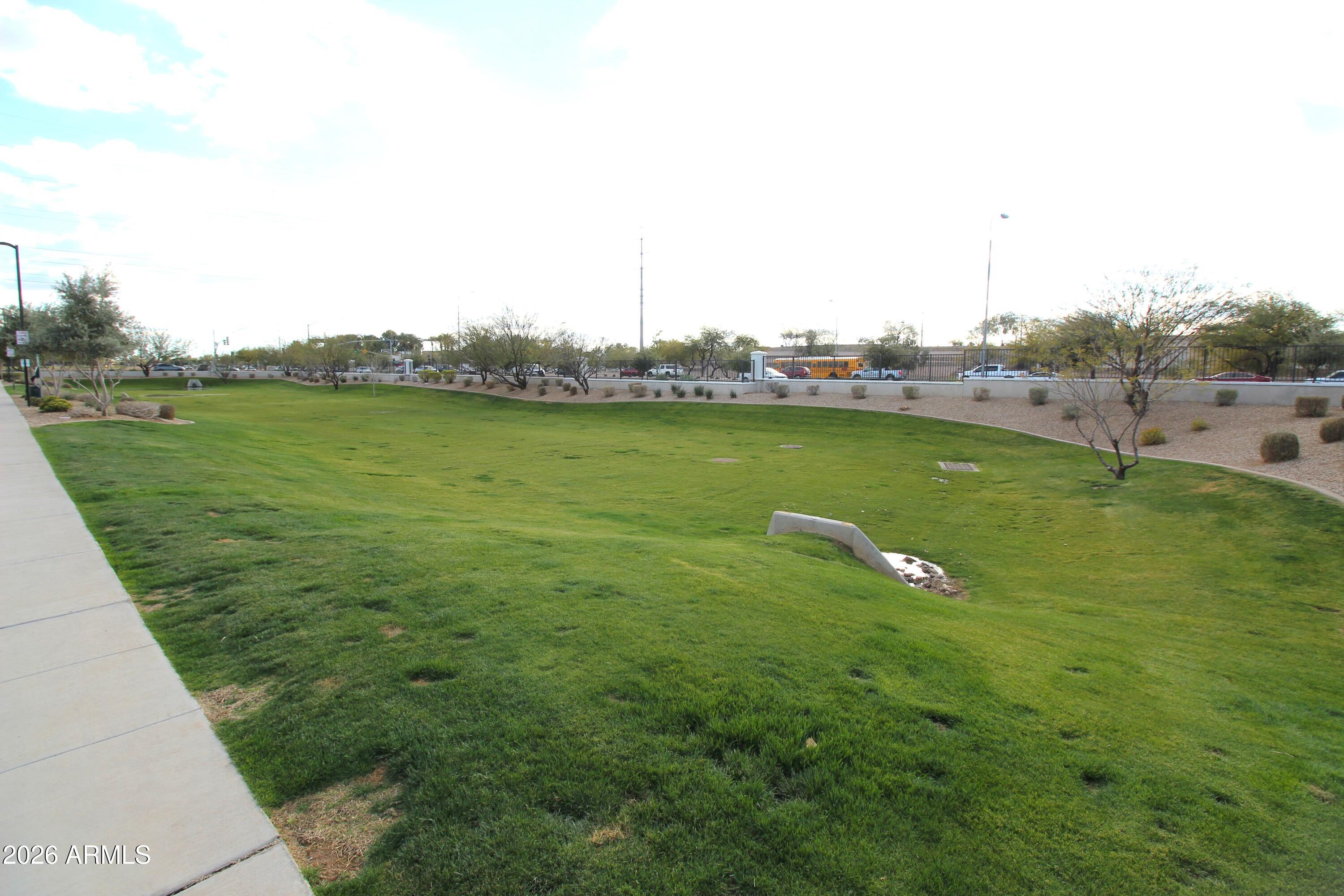 3855 South McQueen Road, Unit 110 Chandler, AZ 85286 - Photo 33 of 37 a view of a lake with houses