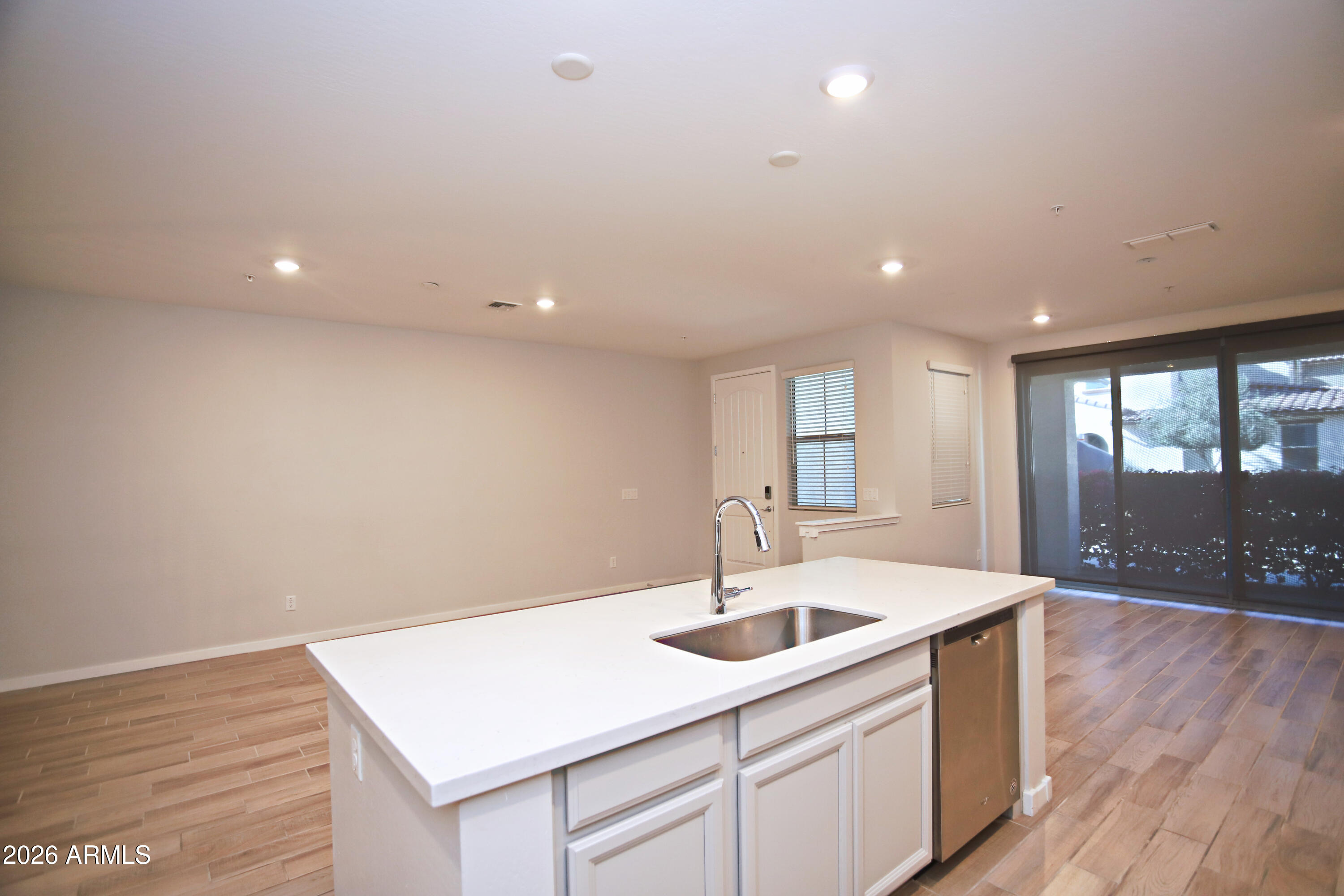 3855 South McQueen Road, Unit 110 Chandler, AZ 85286 - Photo 9 of 37 a kitchen with a sink and chandelier