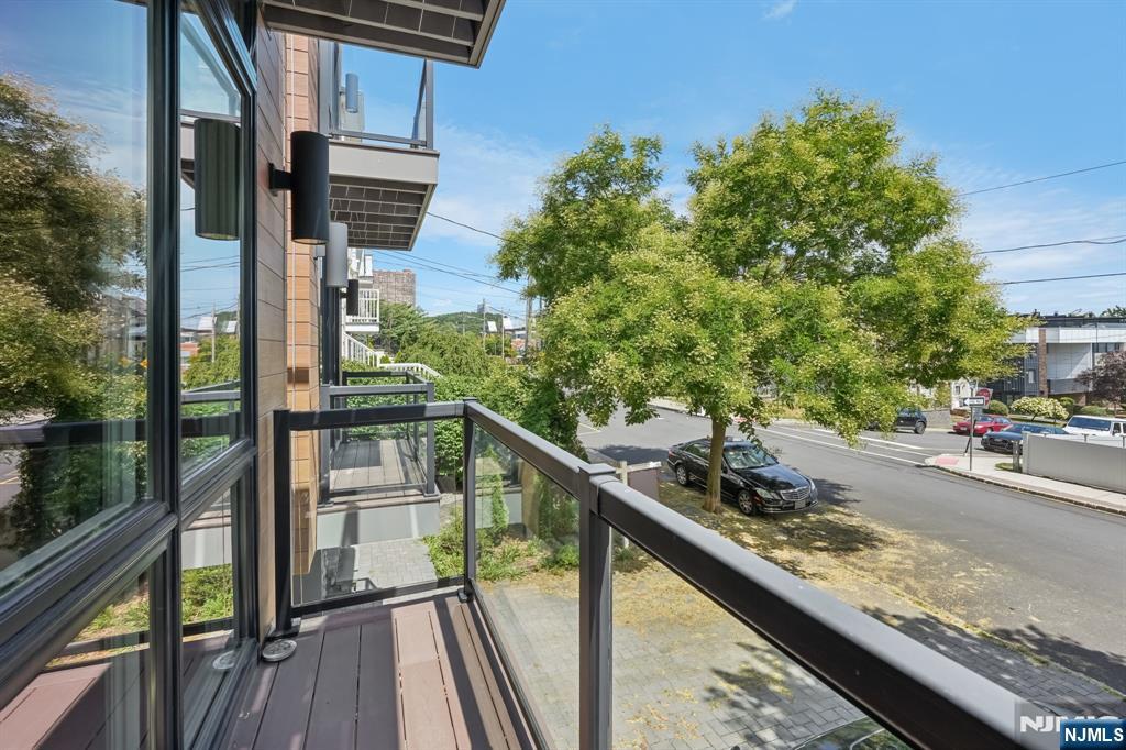 746 Undercliff Avenue, Unit A Edgewater, NJ 07020 - Photo 11 of 44 a view of a balcony with two chairs and a table