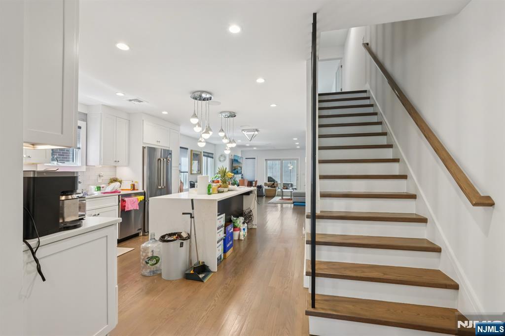 746 Undercliff Avenue, Unit A Edgewater, NJ 07020 - Photo 14 of 44 a kitchen with stainless steel appliances kitchen island sink refrigerator and stove