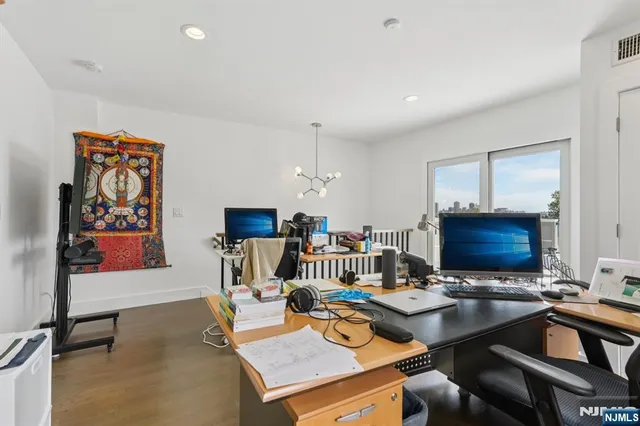 a bathroom with a toilet sink vanity and mirror