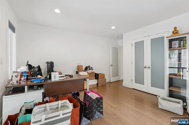 a spacious bedroom with a bed and a couch