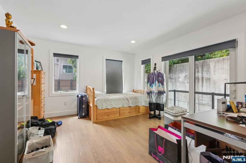 746 Undercliff Avenue, Unit A Edgewater, NJ 07020 - Photo 23 of 44 a living room with furniture and a flat screen tv