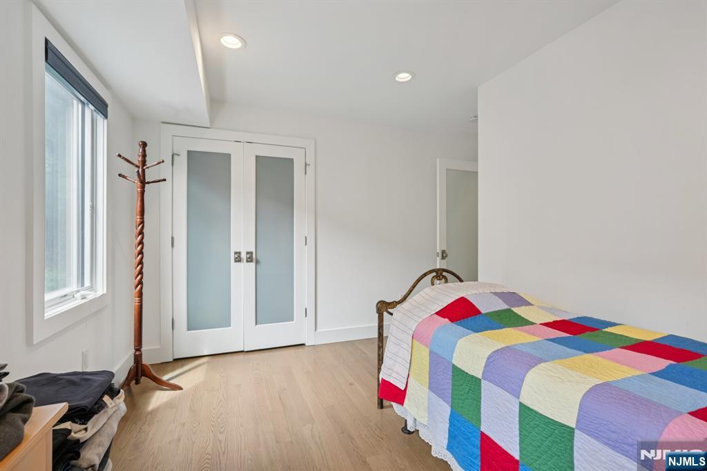 746 Undercliff Avenue, Unit A Edgewater, NJ 07020 - Photo 25 of 44 a room that has a bed and a dresser in it