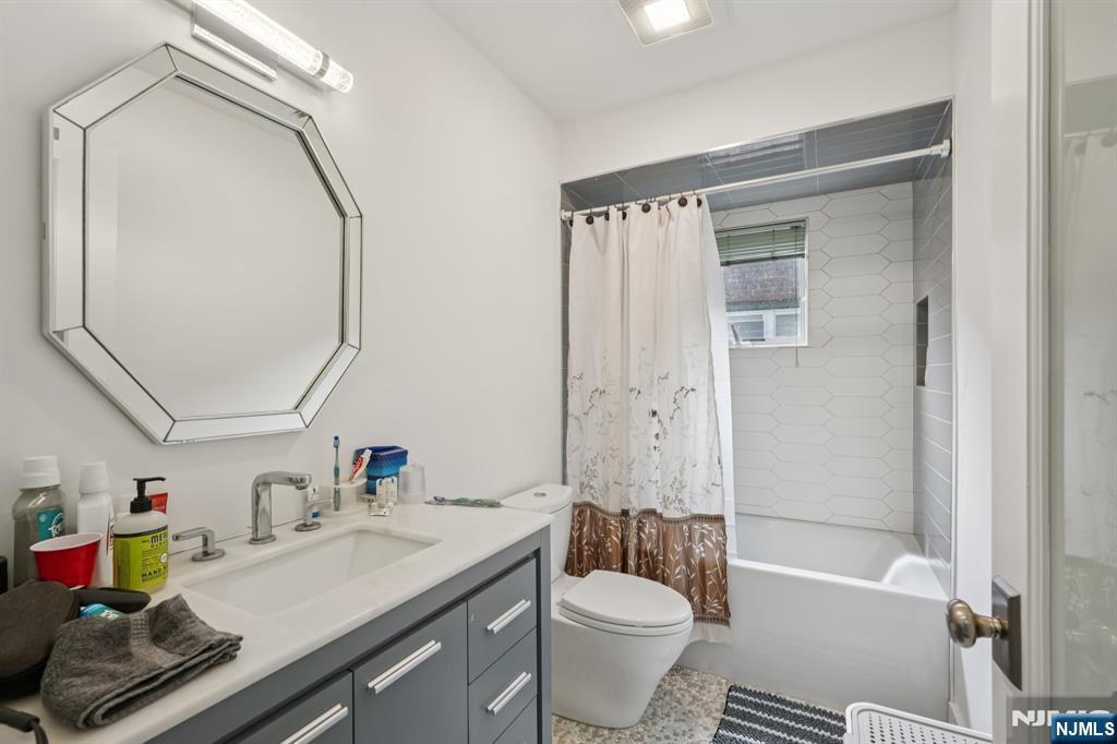 746 Undercliff Avenue, Unit A Edgewater, NJ 07020 - Photo 34 of 44 a bathroom with a sink vanity mirror and toilet