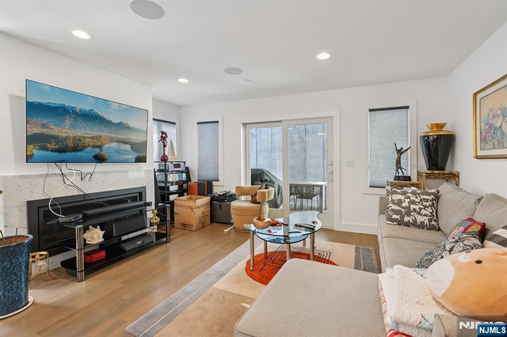 746 Undercliff Avenue, Unit A Edgewater, NJ 07020 - Photo 4 of 44 a living room with furniture a flat screen tv and a window