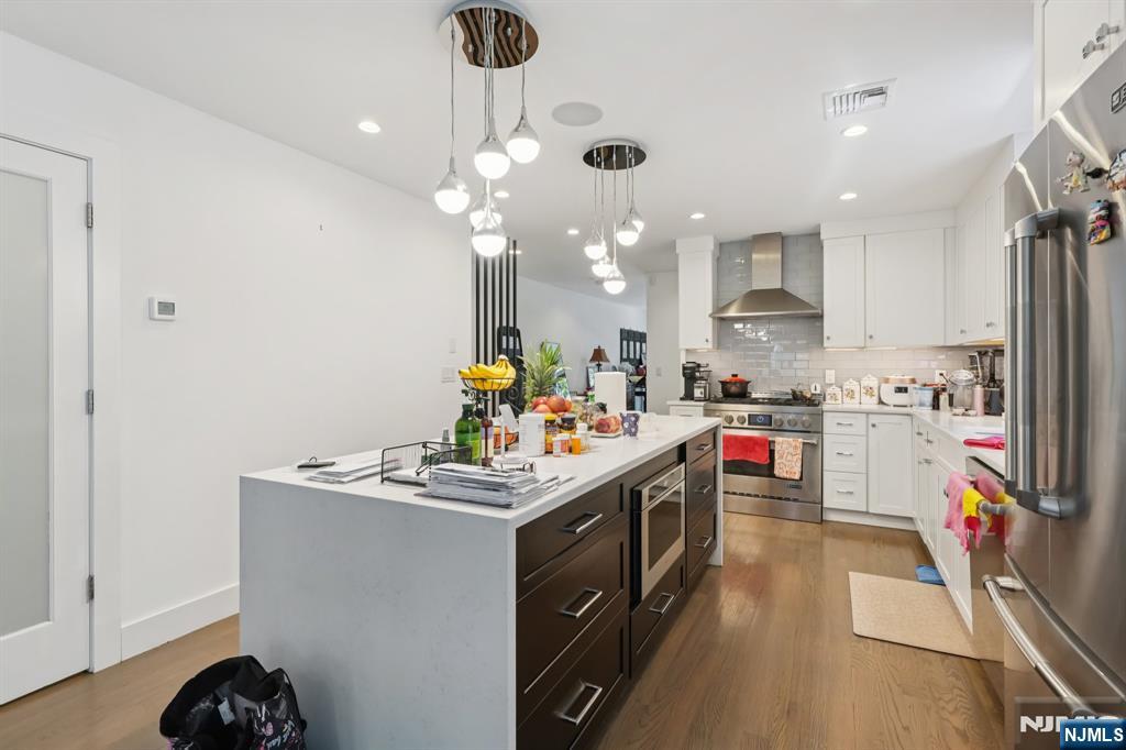 746 Undercliff Avenue, Unit A Edgewater, NJ 07020 - Photo 6 of 44 a kitchen that has a lot of cabinets a sink and appliances