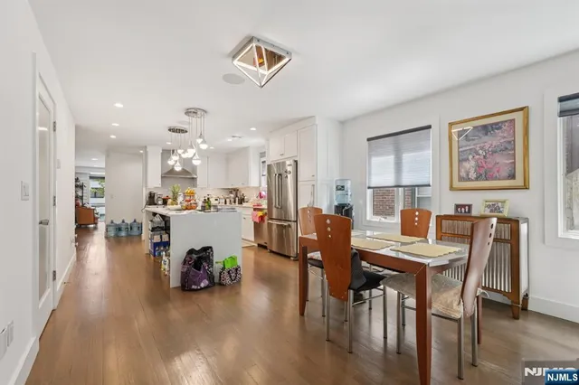 a living room with furniture a floor to ceiling window and gym cycle