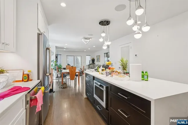 a view of a livingroom with furniture and a flat screen tv