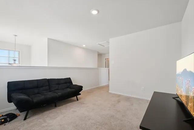 a living room with furniture and a couch