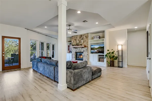 a living room with furniture and wooden floor