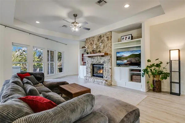 a living room with furniture and a fireplace