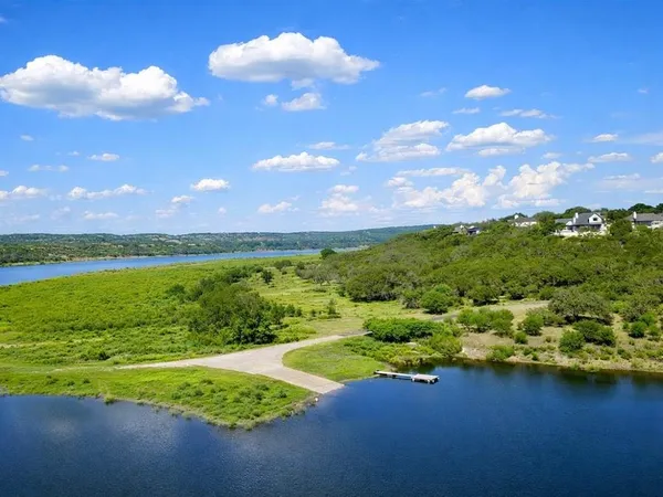a view of a lake with a big yard
