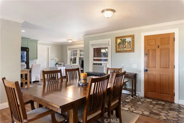 a kitchen with a refrigerator and a stove top oven