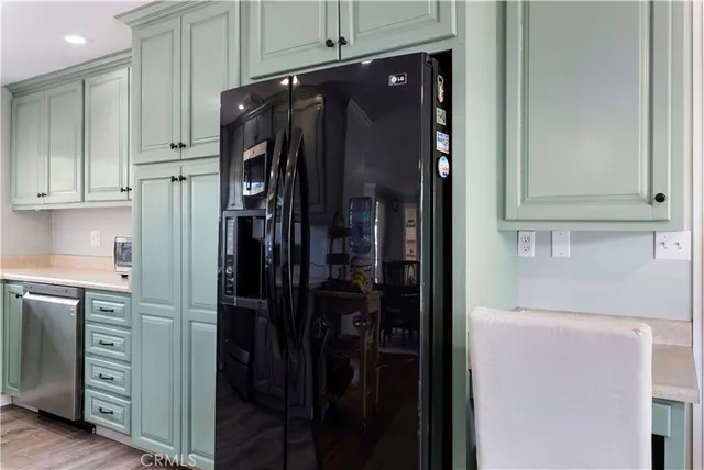 a kitchen with stainless steel appliances a stove a microwave and cabinets