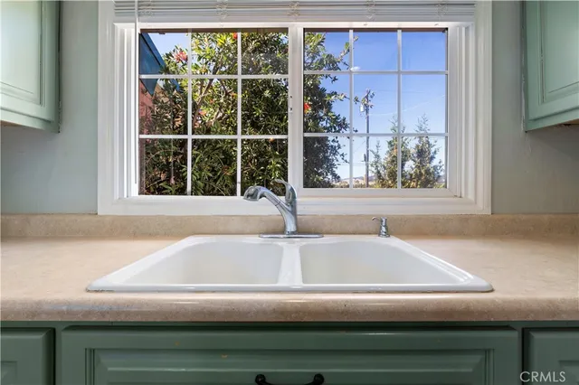 a bedroom with a bed and a lamp