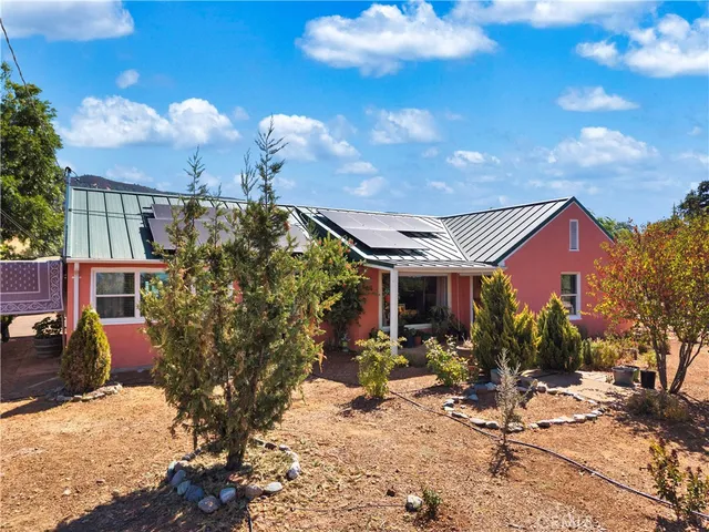 a view of a house with table and chairs