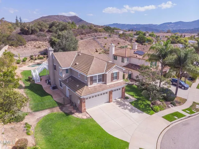 an aerial view of a house with a garden