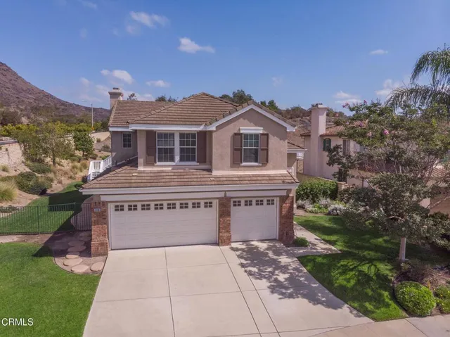 a front view of a house with yard