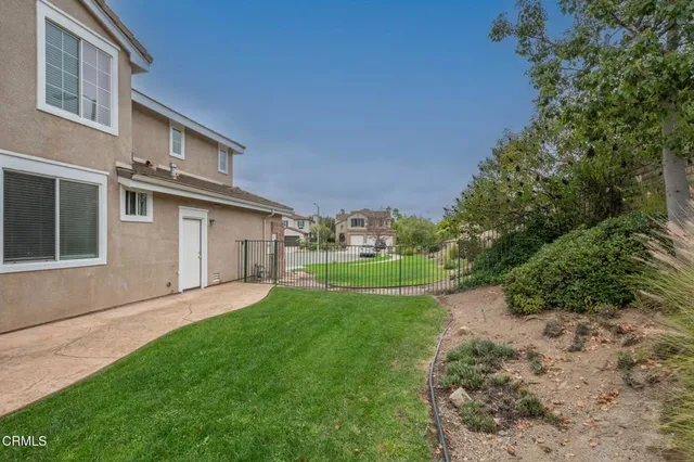 a view of a house with a back yard