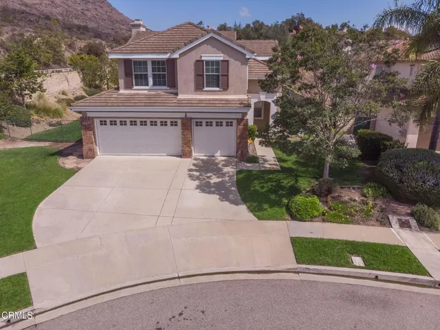 a view of house with outdoor space and a street