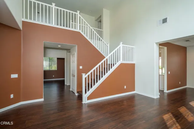 a view of an entryway with wooden floor