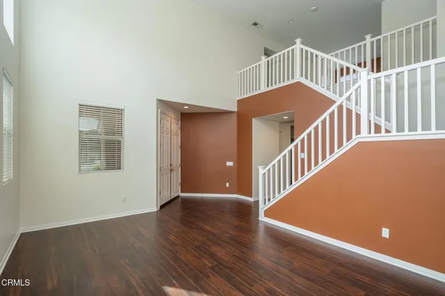 a view of an empty room with stairs