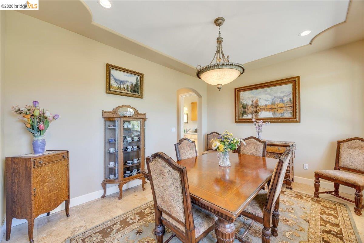 14814 Twist Road Jamestown, CA 95327 - Photo 16 of 60 a dining room with furniture potted plants and wooden floor