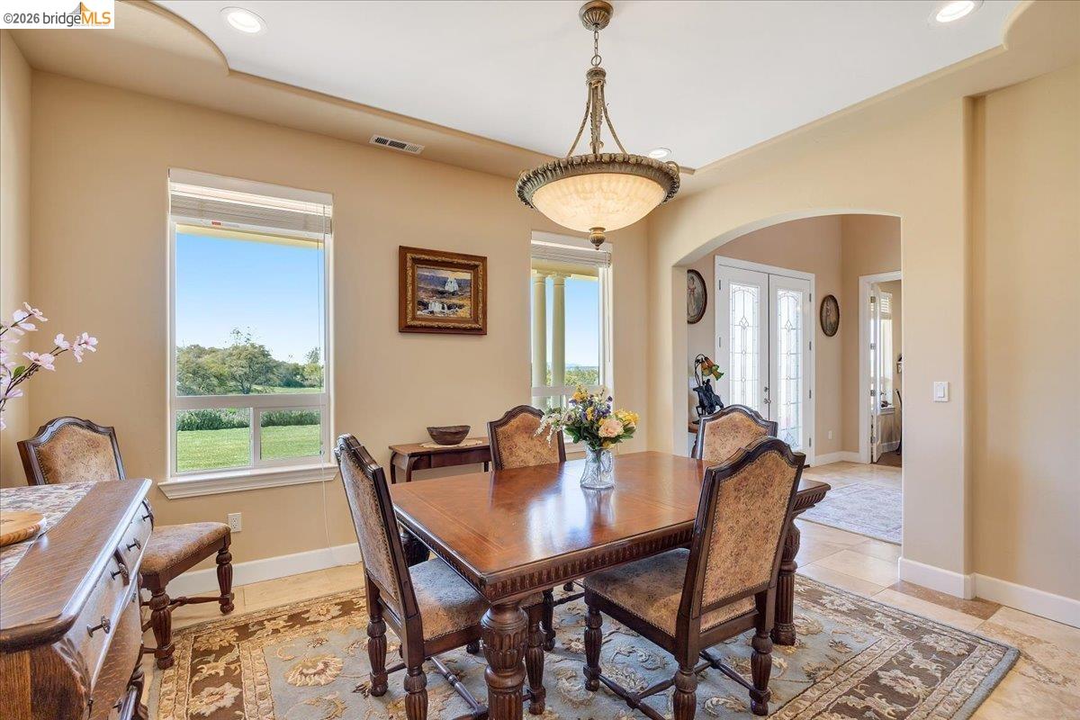14814 Twist Road Jamestown, CA 95327 - Photo 18 of 60 a view of a dining room with furniture window and wooden floor
