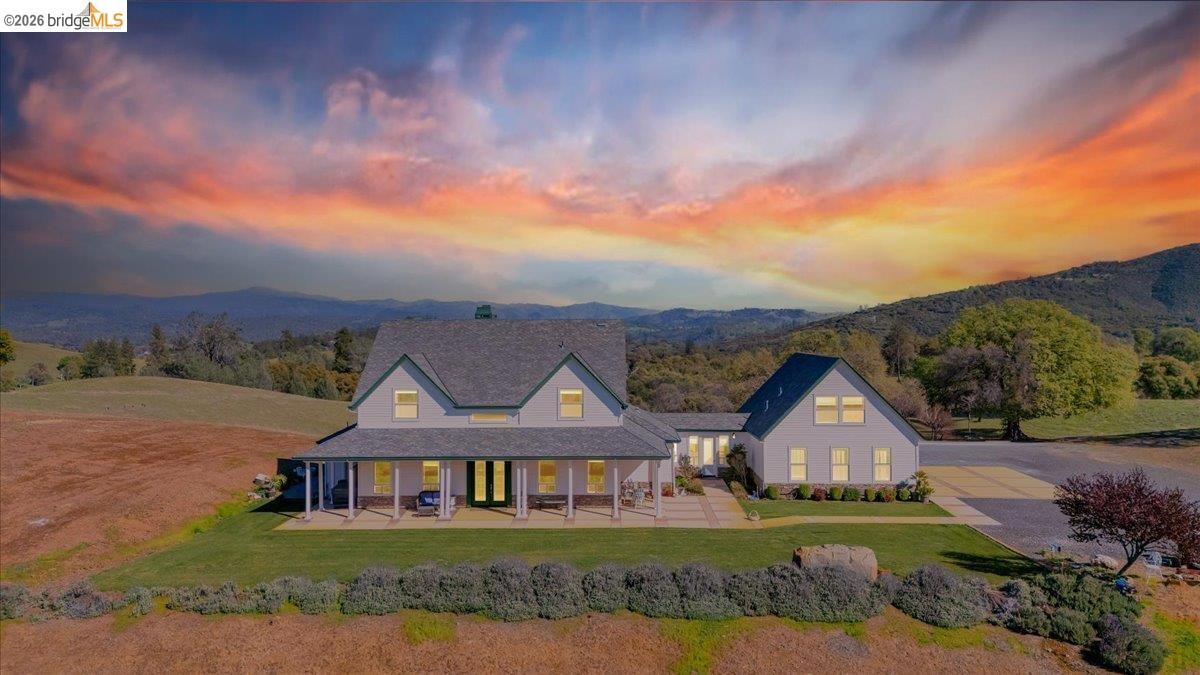 14814 Twist Road Jamestown, CA 95327 - Photo 2 of 60 view of front facade with covered porch, a yard, and a mountain view