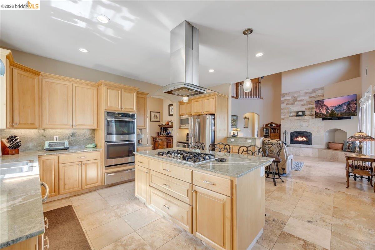 14814 Twist Road Jamestown, CA 95327 - Photo 24 of 60 a kitchen with stainless steel appliances kitchen island granite countertop a sink stove and cabinets