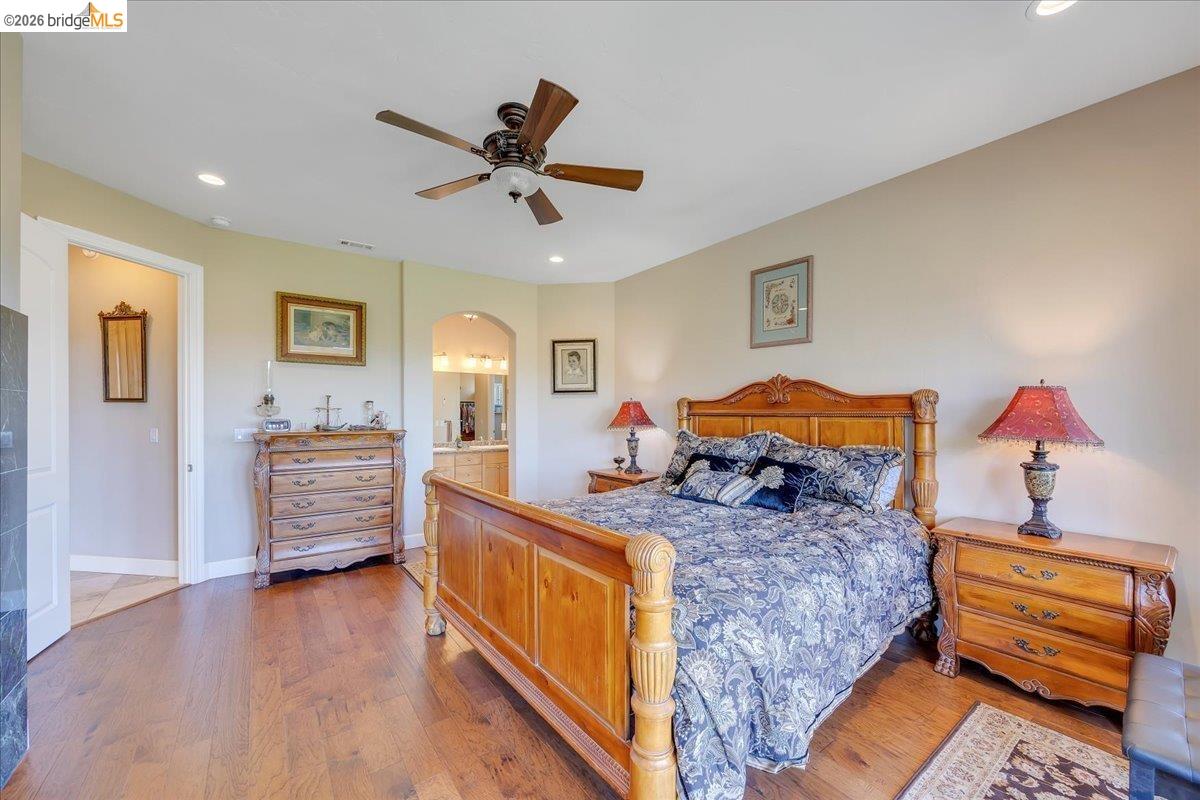 14814 Twist Road Jamestown, CA 95327 - Photo 39 of 60 a bedroom with a bed and wooden floor