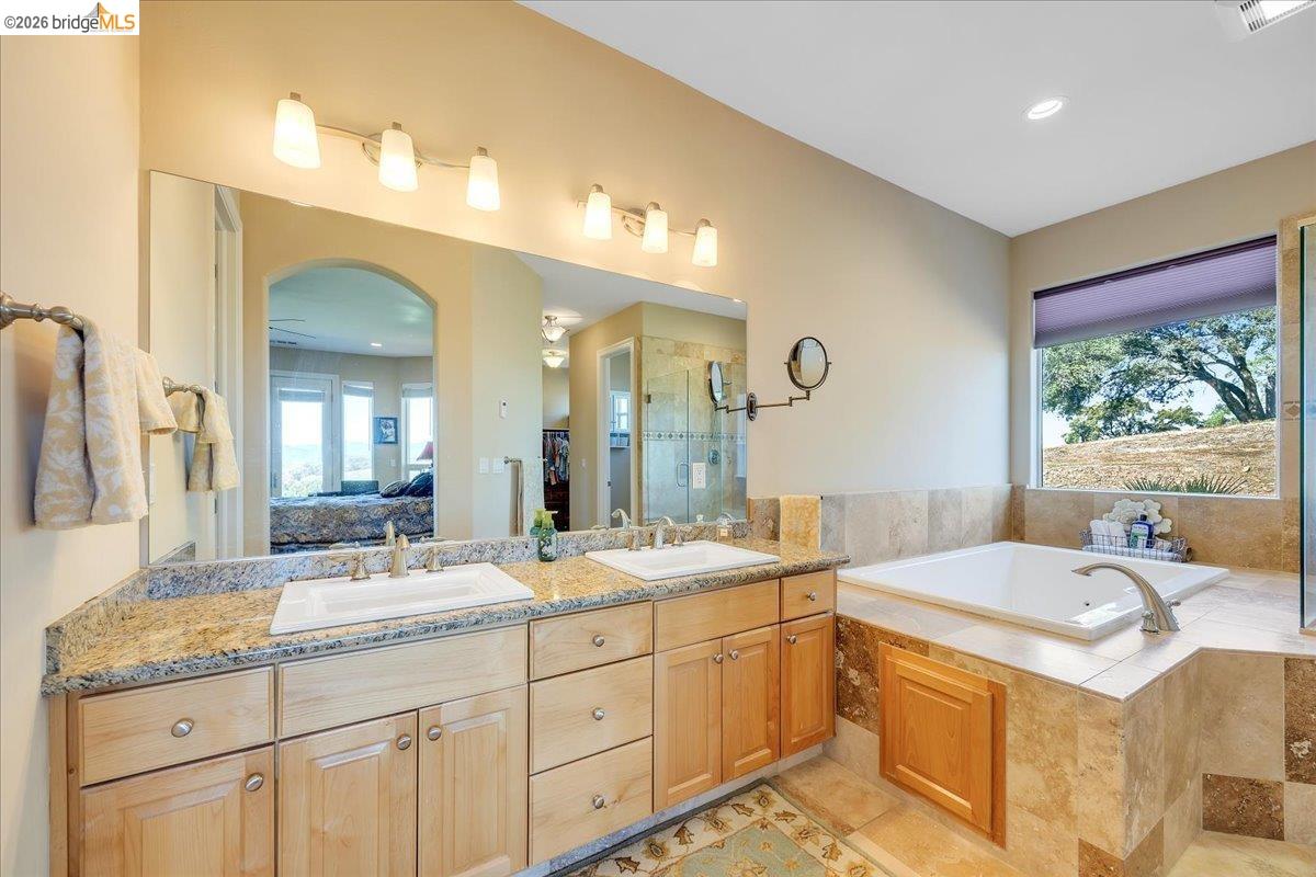 14814 Twist Road Jamestown, CA 95327 - Photo 40 of 60 a bathroom with a sink double vanity granite and a mirror