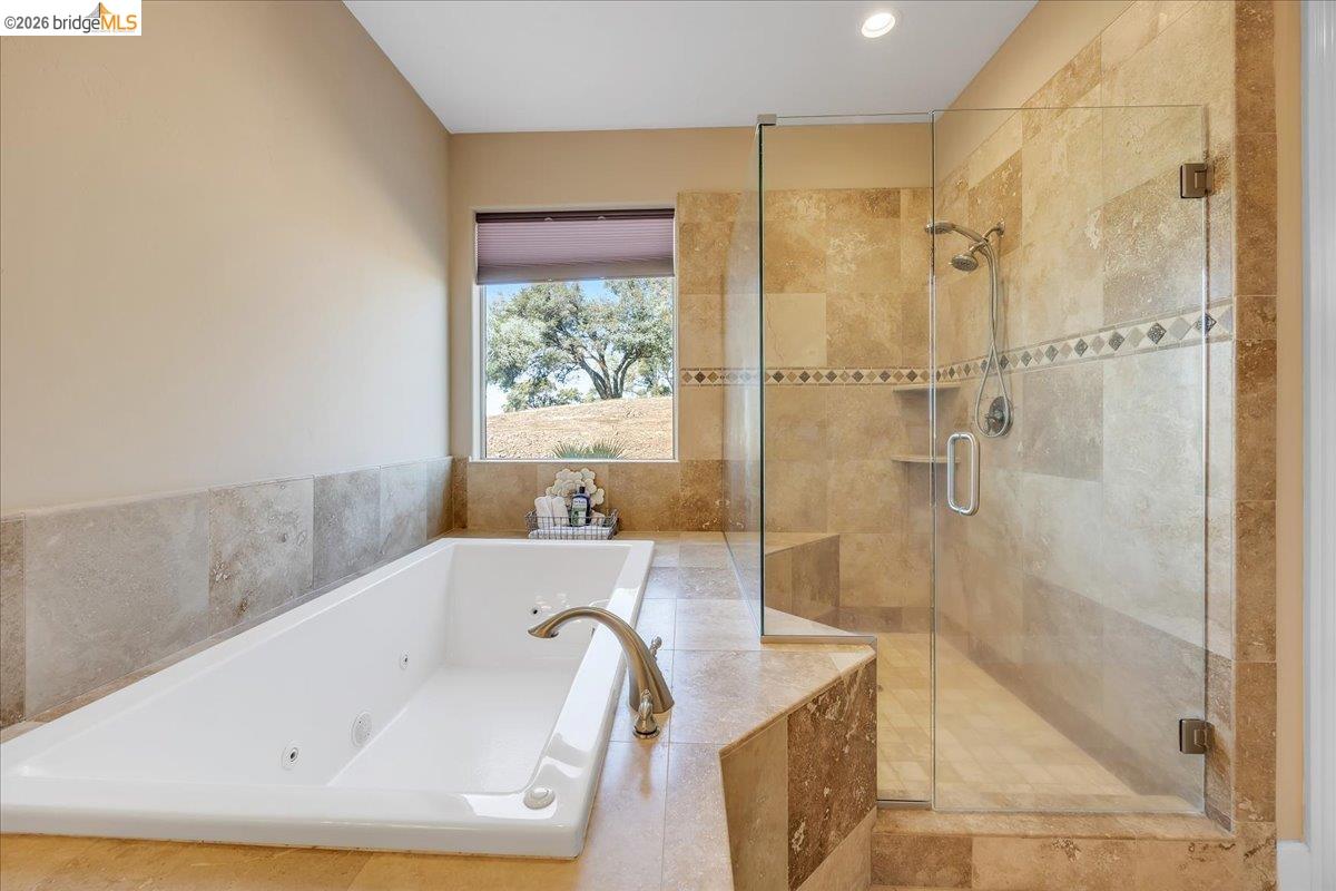 14814 Twist Road Jamestown, CA 95327 - Photo 42 of 60 a bathroom with a tub a sink and a shower