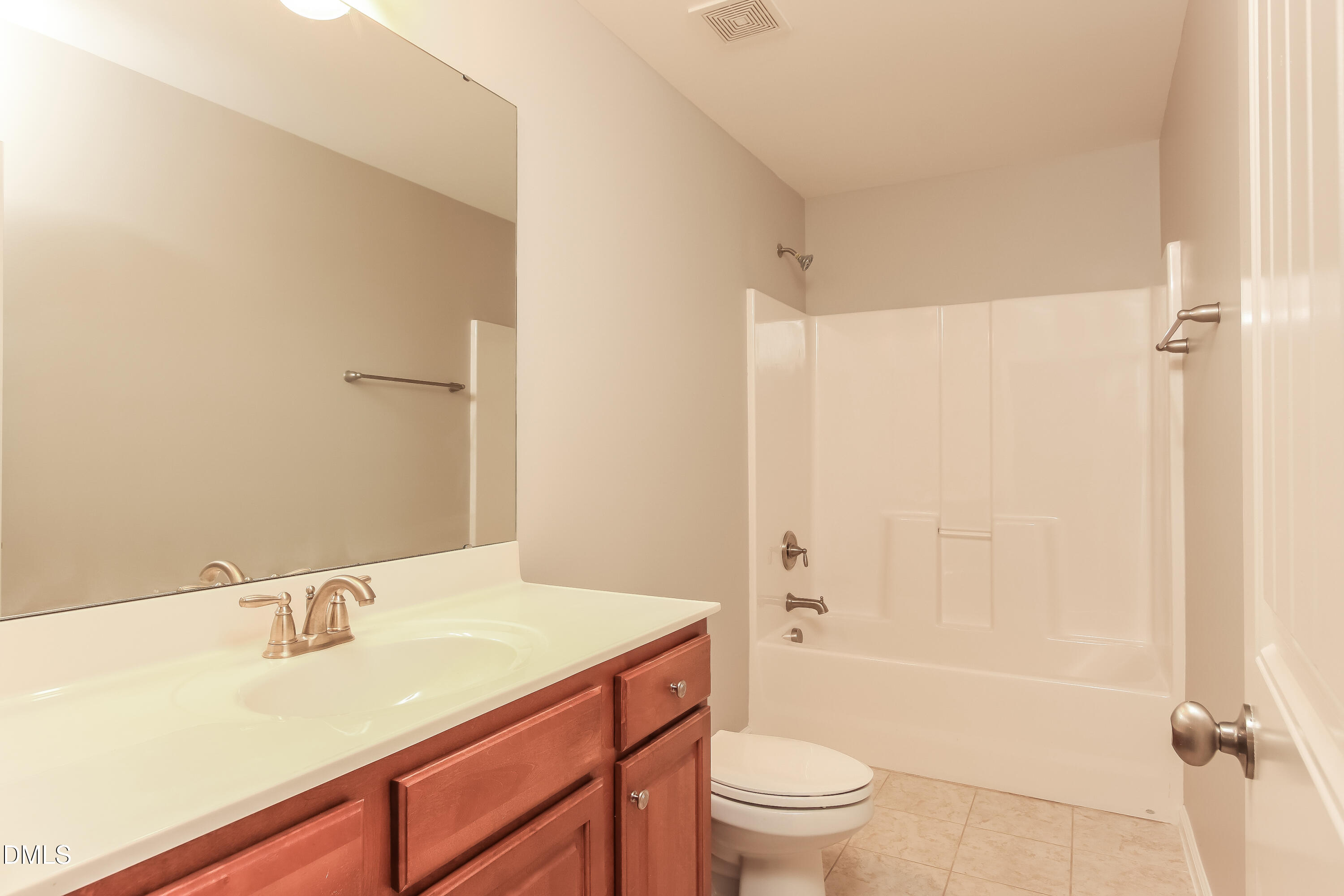 1237 Barnford Mill Road Wake Forest, NC 27587 - Photo 14 of 17 a bathroom with a sink a toilet and shower