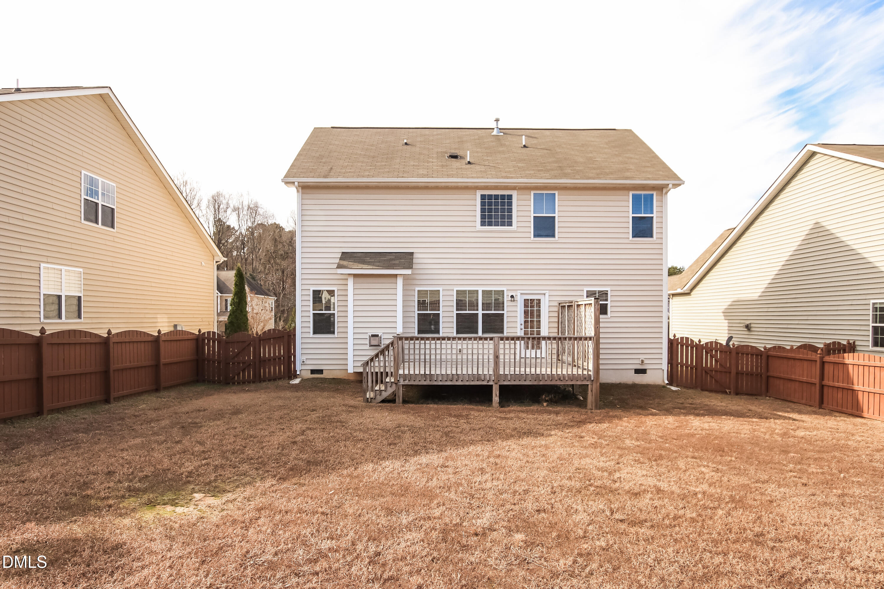 1237 Barnford Mill Road Wake Forest, NC 27587 - Photo 15 of 17 a view of a house with a backyard and a chair