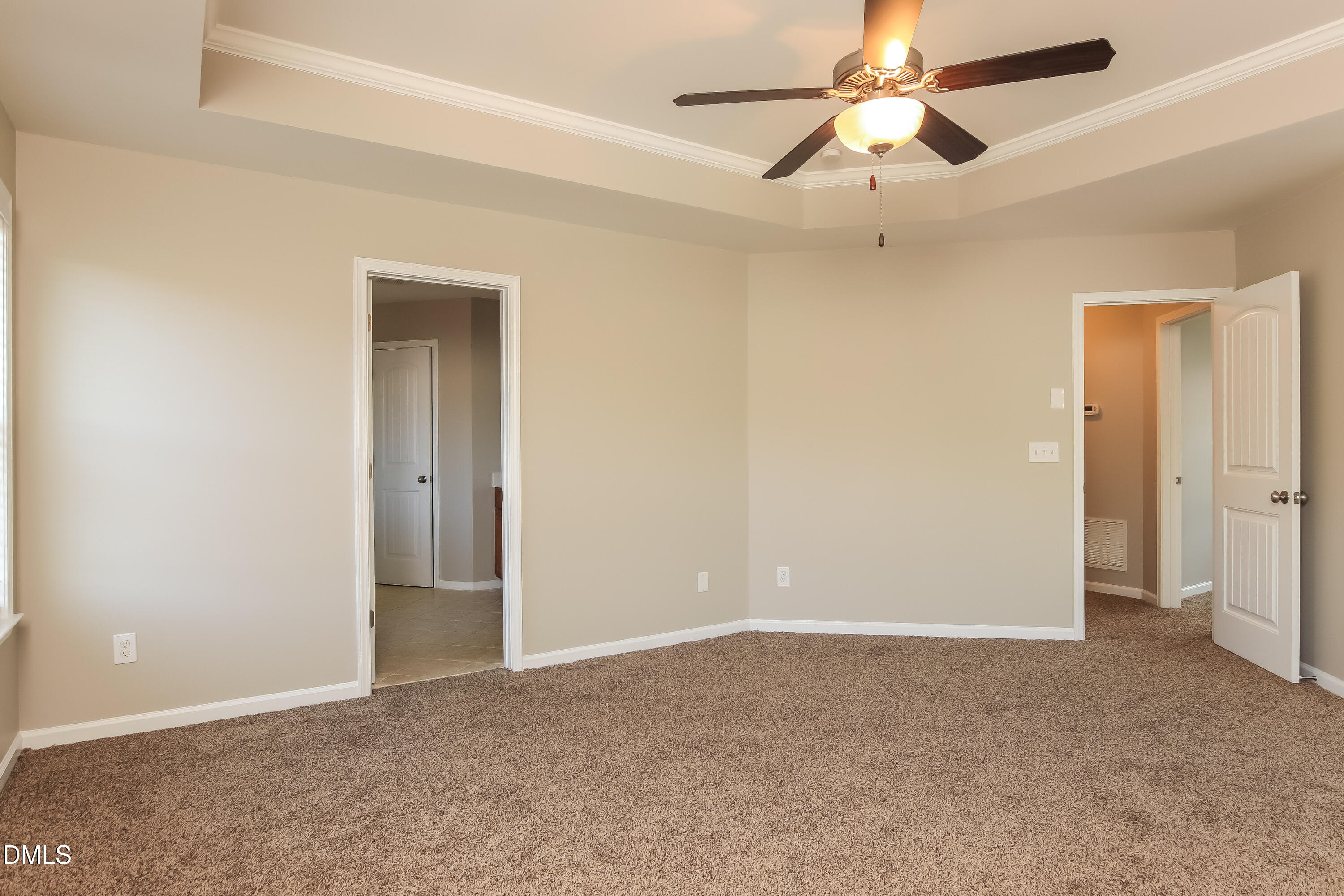 1237 Barnford Mill Road Wake Forest, NC 27587 - Photo 9 of 17 an empty room with closet and a chandelier fan