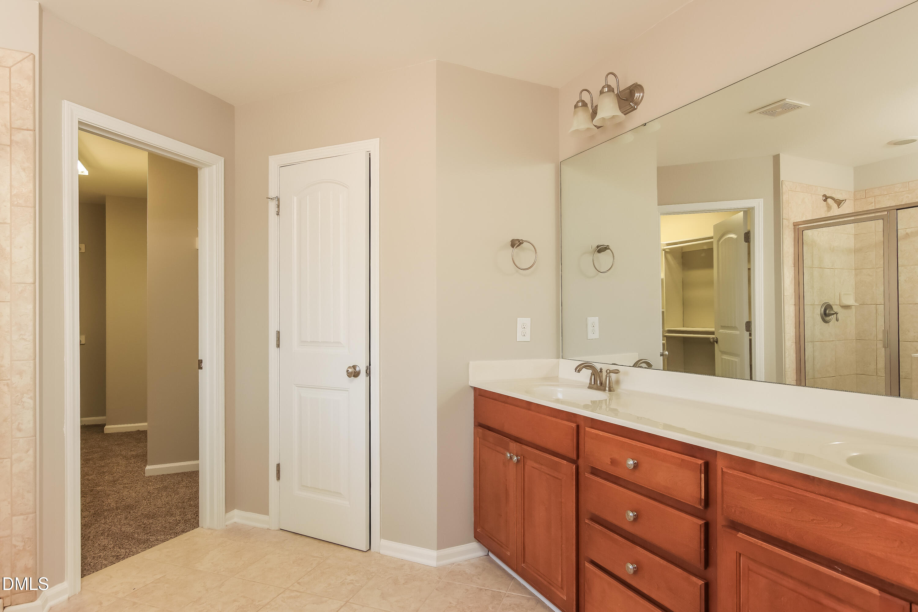 1237 Barnford Mill Road Wake Forest, NC 27587 - Photo 10 of 17 a spacious bathroom with a shower sink double and mirror