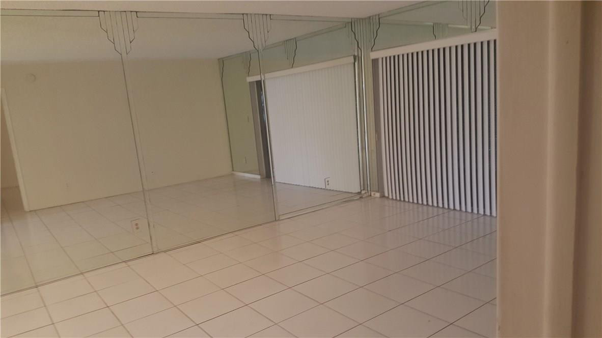 3591 Inverrary Drive, Unit 406 Lauderhill, FL 33319 - Photo 5 of 12 an empty room with cabinet