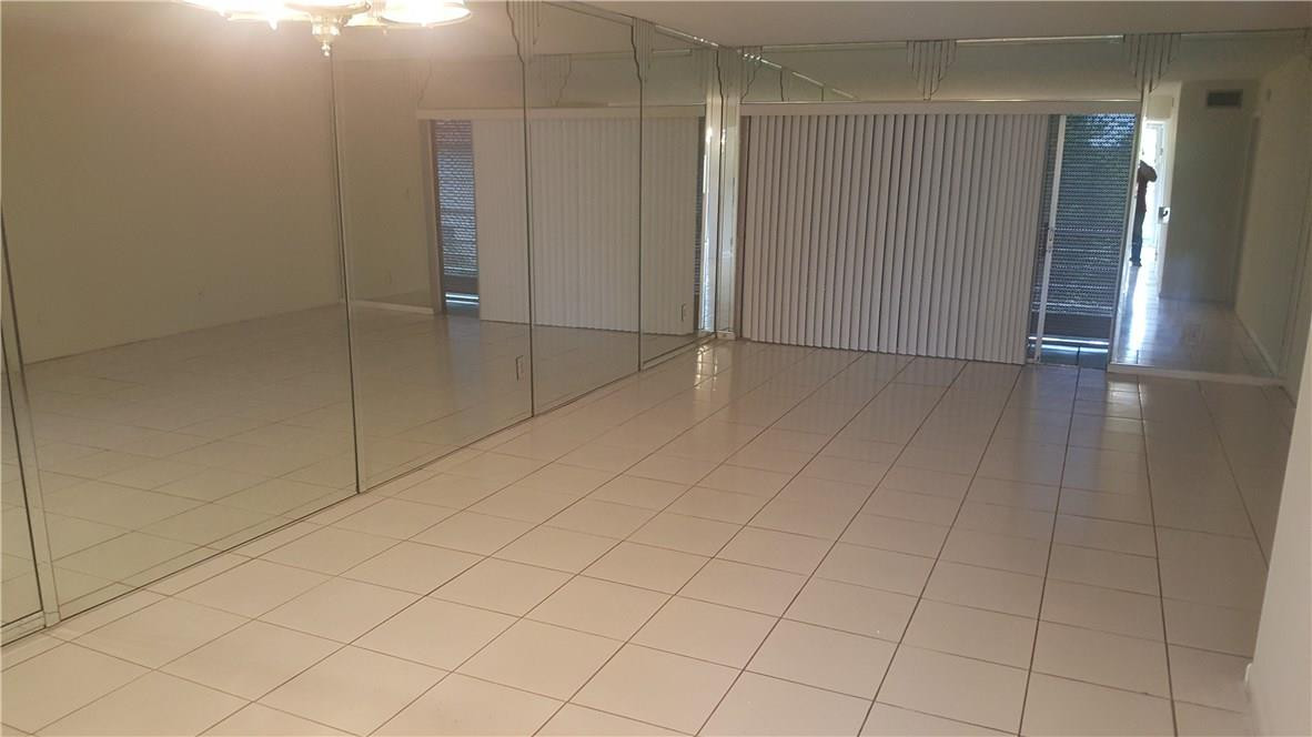 3591 Inverrary Drive, Unit 406 Lauderhill, FL 33319 - Photo 7 of 12 an empty room with entrance