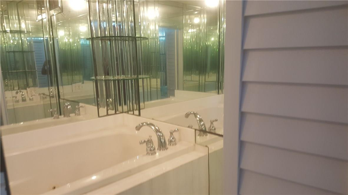 3591 Inverrary Drive, Unit 406 Lauderhill, FL 33319 - Photo 8 of 12 a bathroom with a bathtub and shower