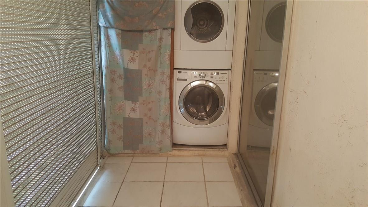 3591 Inverrary Drive, Unit 406 Lauderhill, FL 33319 - Photo 9 of 12 a utility room with dryer and washer